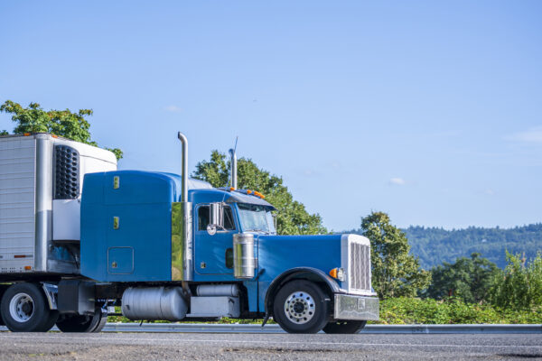 Classic big rig truck representing how a freight driver can land the perfect job with 24/7 Express Logistics