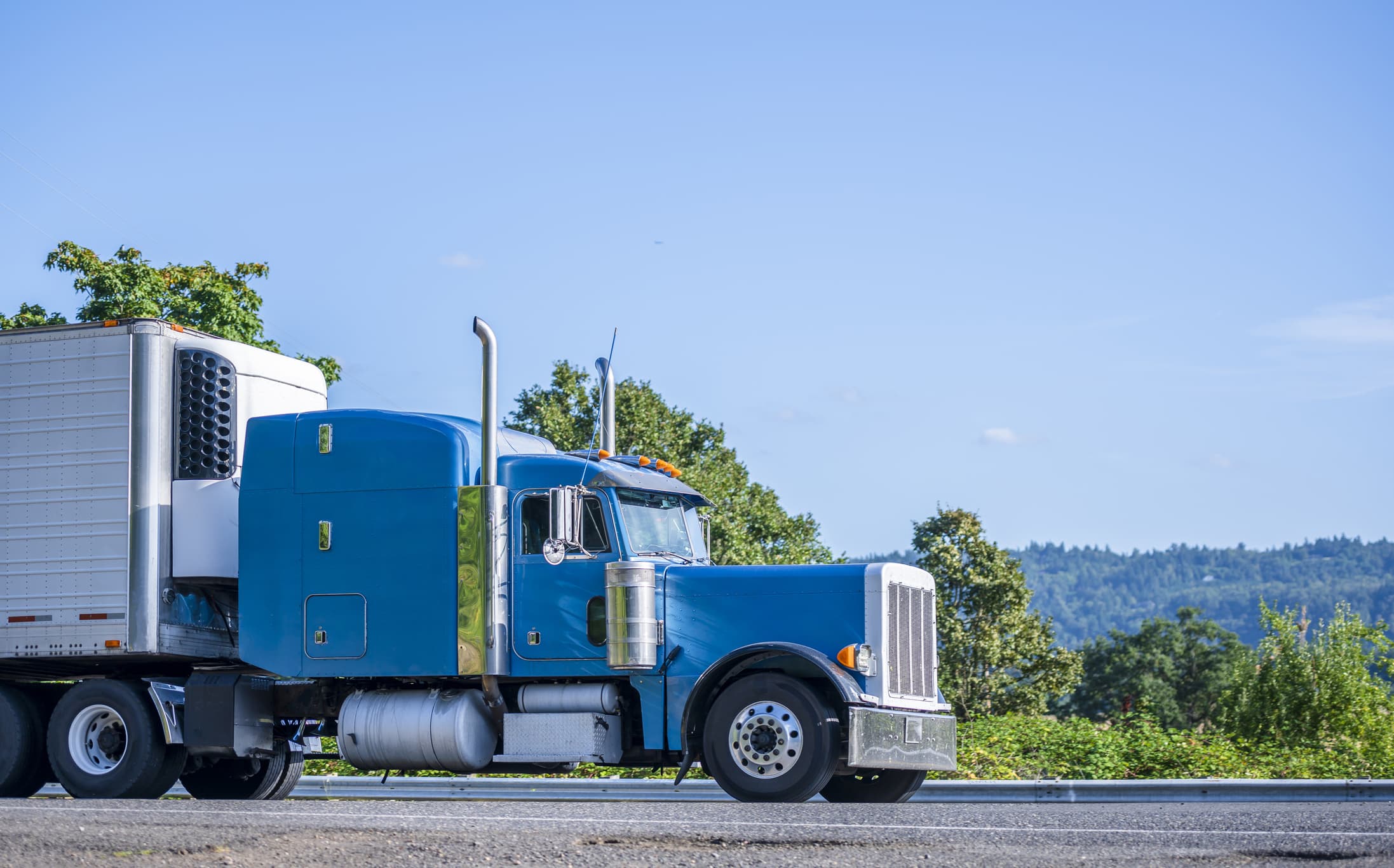 Classic big rig truck representing how a freight driver can land the perfect job with 24/7 Express Logistics